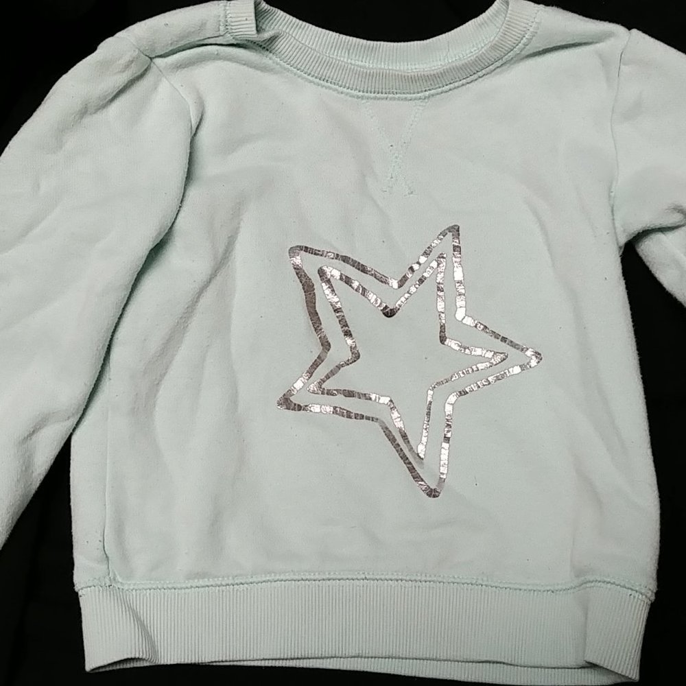 Teal Sweatshirt with a Silver Star in the Center
